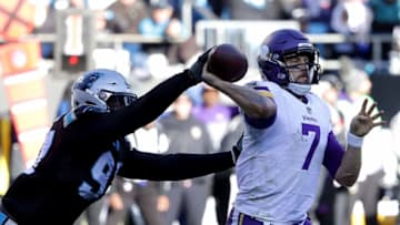 CHARLOTTE, NC - DECEMBER 10: Mario Addison #97 of the Carolina Panthers strips the ball from Case Keenum #7 of the Minnesota Vikings in the third quarter during their game at Bank of America Stadium on December 10, 2017 in Charlotte, North Carolina. (Photo by Streeter Lecka/Getty Images)