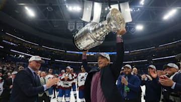 TAMPA, FLORIDA - JUNE 26: General Manager Joe Sakic of the Colorado Avalanche lifts the Stanley Cup after defeating the Tampa Bay Lightning 2-1 in Game Six of the 2022 NHL Stanley Cup Final at Amalie Arena on June 26, 2022 in Tampa, Florida. (Photo by Bruce Bennett/Getty Images)