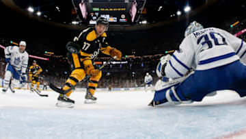 Jan 14, 2023; Boston, Massachusetts, USA; Boston Bruins center Patrice Bergeron (37) deflects a pass past Toronto Maple Leafs goaltender Matt Murray (30) for a goal during the first period at TD Garden. Mandatory Credit: Winslow Townson-USA TODAY Sports