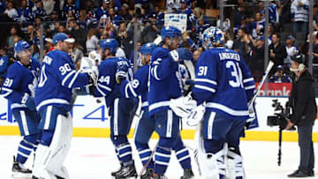 Auston Matthew #34 of the Toronto Maple Leafs congratulates Frederik Andersen #31 after the final whistle of an NHL pre-season game against the Detroit Red Wings at Scotiabank Arena on September 28, 2019 in Toronto, Canada. (Photo by Vaughn Ridley/Getty Images)