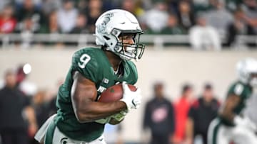 EAST LANSING, MICHIGAN - OCTOBER 02: Kenneth Walker III #9 of the Michigan State Spartans runs the ball against the Western Kentucky Hilltoppers during the first half of the game at Spartan Stadium on October 02, 2021 in East Lansing, Michigan. (Photo by Nic Antaya/Getty Images)