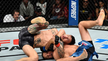 FRESNO, CA - DECEMBER 09: (R-L) Brian Ortega attempts to submit in their featherweight bout during the UFC Fight Night event inside Save Mart Center on December 9, 2017 in Fresno, California. (Photo by Jeff Bottari/Zuffa LLC/Zuffa LLC via Getty Images)