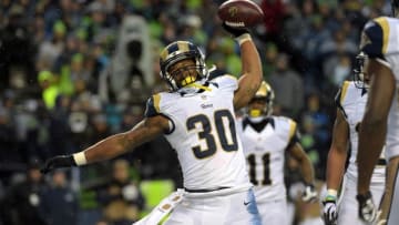 Dec 27, 2015; Seattle, WA, USA; St. Louis Rams running back Todd Gurley (30) spikes the ball after scoring on a 2-yard touchdown run in the fourth quarter against the Seattle Seahawks during an NFL football game at CenturyLink Field. Mandatory Credit: Kirby Lee-USA TODAY Sports