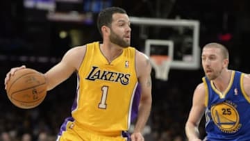 Apr 11, 2014; Los Angeles, CA, USA; Los Angeles Lakers guard Jordan Farmar (1) dribbles as Golden State Warriors guard Steve Blake (25) defends at Staples Center. Mandatory Credit: Richard Mackson-USA TODAY Sports