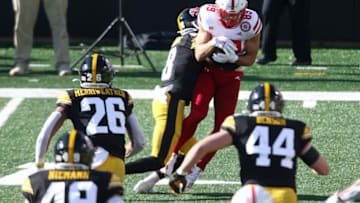 IOWA CITY, IOWA- NOVEMBER 27: Wide receiver Oliver Martin #89 of the Nebraska Cornhuskers is tackled in the first half by defensive back Matt Hankins #8 of the Iowa Hawkeyes at Kinnick Stadium on November 27, 2020 in Iowa City, Iowa. (Photo by Matthew Holst/Getty Images)