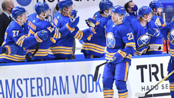 Jan 28, 2021; Buffalo, New York, USA; Buffalo Sabres right wing Sam Reinhart (23) is congratulated by teammates after scoring a goal against the New York Rangers in the third period at KeyBank Center. Mandatory Credit: Mark Konezny-USA TODAY Sports