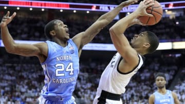 LOUISVILLE, KENTUCKY - FEBRUARY 02: Kenny Williams #24 of the North Carolina Tar Heels defends the shot of Christen Cunningham #1 of the Louisville Cardinals at KFC YUM! Center on February 02, 2019 in Louisville, Kentucky. (Photo by Andy Lyons/Getty Images)