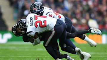 LONDON, ENGLAND - NOVEMBER 03: Keelan Cole of Jacksonville Jaguars is tackled by Mike Adams and Bernardrick McKinney of Houston Texans during the NFL game between Houston Texans and Jacksonville Jaguars at Wembley Stadium on November 03, 2019 in London, England. (Photo by Alex Davidson/Getty Images)
