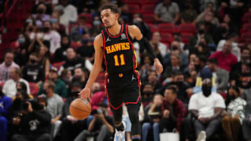 MIAMI, FLORIDA - JANUARY 14: Trae Young #11 of the Atlanta Hawks dribbles the ball up the court against the Miami Heat in the first half at FTX Arena on January 14, 2022 in Miami, Florida. NOTE TO USER: User expressly acknowledges and agrees that, by downloading and or using this photograph, User is consenting to the terms and conditions of the Getty Images License Agreement. (Photo by Mark Brown/Getty Images)