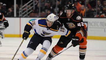 January 8, 2016; Anaheim, CA, USA; St. Louis Blues center Robby Fabbri (15) moves the puck against Anaheim Ducks defenseman Josh Manson (42) during the third period at Honda Center. Mandatory Credit: Gary A. Vasquez-USA TODAY Sports