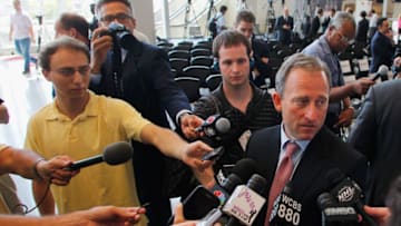 NEWARK, NJ - AUGUST 15: New Jersey Devils owner Joshua Harris (R) is interviewed by the media during the press conference announcing the new ownership of the New Jersey Devils on August 15, 2013 in Newark, New Jersey. (Photo by Andy Marlin/Getty Images)