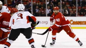 Feb 10, 2016; Detroit, MI, USA; Detroit Red Wings left wing Henrik Zetterberg (40) skates with the puck defended by Ottawa Senators defenseman Marc Methot (3) in the third period at Joe Louis Arena. Detroit won 3-1. Mandatory Credit: Rick Osentoski-USA TODAY Sports