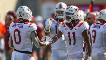 Sep 11, 2021; Blacksburg, Virginia, USA; Virginia Tech Hokies wide receiver Jalen Holston (0) celebrates with wide receiver Tré Turner (11) after a touchdown against Middle Tennessee Blue Raiders during the third quarter at Lane Stadium. Mandatory Credit: Ryan Hunt-USA TODAY Sports