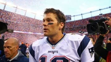 Jan 24, 2016; Denver, CO, USA; New England Patriots quarterback Tom Brady (12) reacts as he leaves the field following the game against the Denver Broncos in the AFC Championship football game at Sports Authority Field at Mile High. Mandatory Credit: Mark J. Rebilas-USA TODAY Sports