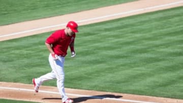 Mar 6, 2015; Tempe, AZ, USA; Los Angeles Angels outfielder Mike Trout (27) walks to first base in the first inning during a spring training baseball game against the Colorado Rockies at Tempe Diablo Stadium. The Angels beat the Rockies 3-0. Mandatory Credit: Allan Henry-USA TODAY Sports