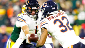 Dec 12, 2021; Green Bay, Wisconsin, USA; Chicago Bears quarterback Justin Fields (1) hands the football off to running back David Montgomery (32) during the third quarter against the Green Bay Packers at Lambeau Field. Mandatory Credit: Jeff Hanisch-USA TODAY Sports