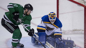 May 7, 2016; Dallas, TX, USA; St. Louis Blues goalie Brian Elliott (1) makes a save against Dallas Stars center Radek Faksa (12) during the third period in game five of the second round of the 2016 Stanley Cup Playoffs at American Airlines Center. The Blues won 4-1. Mandatory Credit: Jerome Miron-USA TODAY Sports