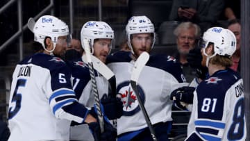 LOS ANGELES, CALIFORNIA - OCTOBER 28: Pierre-Luc Dubois #80 of the Winnipeg Jets celebrates his goal with Kyle Connor #81, Evgeny Svechnikov #71 and Brenden Dillon #5, to take a 3-2 lead over the Los Angeles Kings during the third period in a 3-2 win at Staples Center on October 28, 2021 in Los Angeles, California. (Photo by Harry How/Getty Images)