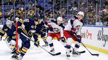 BUFFALO, NY - NOVEMBER 20: Columbus Blue Jackets Left Wing Sonny Milano (22) looks to pass as Buffalo Sabres Defenseman Nathan Beaulieu (82) defends and Columbus Blue Jackets Right Wing Markus Hannikainen (37) looks on during the Columbus Blue Jackets and Buffalo Sabres NHL game on November 20, 2017, at KeyBank Center in Buffalo, NY. (Photo by John Crouch/Icon Sportswire via Getty Images)