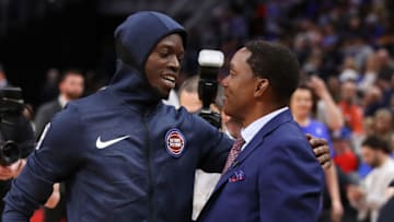 DETROIT, MICHIGAN - MARCH 30: Former Detroit Piston Isiah Thomas talks to Reggie Jackson #1 of the Detroit Pistons after a celebration of the 1989 and 1990 World Championship Detroit Pistons at halftime during a game between the Portland Trail Blazers and Detroit Pistons at Little Caesars Arena on March 30, 2019 in Detroit, Michigan. NOTE TO USER: User expressly acknowledges and agrees that, by downloading and or using this photograph, User is consenting to the terms and conditions of the Getty Images License Agreement. (Photo by Gregory Shamus/Getty Images)