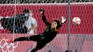 Mexico's goalkeeper Guillermo Ochoa dives after the penalty during the Tokyo 2020 Olympic Games men's semi-final football match between Mexico and Brazil at Ibaraki Kashima Stadium in Kashima city, Ibaraki prefecture on August 3, 2021. (Photo by MARTIN BERNETTI / AFP) (Photo by MARTIN BERNETTI/AFP via Getty Images)