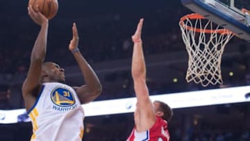 November 4, 2015; Oakland, CA, USA; Golden State Warriors center Festus Ezeli (31) shoots the basketball against Los Angeles Clippers forward Blake Griffin (32) during the first quarter at Oracle Arena. The Warriors defeated the Clippers 112-108. Mandatory Credit: Kyle Terada-USA TODAY Sports
