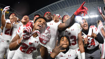 MIAMI GARDENS, FL - DECEMBER 30: Wisconsin Badgers players celebrate winning the 2017 Capital One Orange Bowl against the Miami Hurricanes at Hard Rock Stadium on December 30, 2017 in Miami Gardens, Florida. (Photo by Rob Foldy/Getty Images)