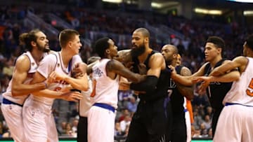 Dec 13, 2016; Phoenix, AZ, USA; (From left) New York Knicks center Joakim Noah holds back forward Kristaps Porzingis as guard Brandon Jennings pushes Phoenix Suns center Tyson Chandler as guard Devin Booker comes in during a third quarter fight at Talking Stick Resort Arena. Mandatory Credit: Mark J. Rebilas-USA TODAY Sports
