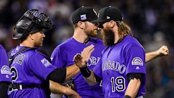 DENVER, CO - SEPTEMBER 8: Charlie Blackmon #19, Wade Davis #71 and Chris Iannetta #22 of the Colorado Rockies celebrate closing out a 4-2 win over the Los Angeles Dodgers at Coors Field on September 8, 2018 in Denver, Colorado. (Photo by Dustin Bradford/Getty Images)