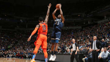 MINNEAPOLIS, MN - APRIL 7: Andrew Wiggins #22 of the Minnesota Timberwolves shoots a three-pointer against Paul George #13 of the Oklahoma City Thunder on April 7, 2019 at Target Center in Minneapolis, Minnesota. NOTE TO USER: User expressly acknowledges and agrees that, by downloading and or using this Photograph, user is consenting to the terms and conditions of the Getty Images License Agreement. Mandatory Copyright Notice: Copyright 2019 NBAE (Photo by David Sherman/NBAE via Getty Images)