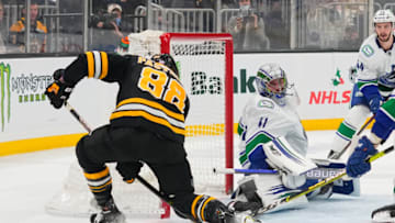 Nov 28, 2021; Boston, Massachusetts, USA; Boston Bruins right wing David Pastrnak (88) scores a goal on Vancouver Canucks goalie Jaroslav Halak (41) during the third period at TD Garden. Mandatory Credit: Gregory Fisher-USA TODAY Sports