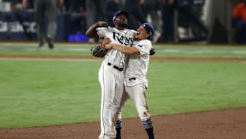 SAN DIEGO, CALIFORNIA - OCTOBER 17: Randy Arozarena#56 and Willy Adames #1 of the Tampa Bay Rays celebrate a 4-2 win against the Houston Astros to win the series in Game Seven of the American League Championship Series at PETCO Park on October 17, 2020 in San Diego, California. (Photo by Ezra Shaw/Getty Images)