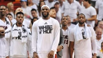 May 30, 2014; Miami, FL, USA; Miami Heat forward LeBron James (middle) leads teammates in celebration from the bench during the second half in game six of the Eastern Conference Finals of the 2014 NBA Playoffs against the Indiana Pacers at American Airlines Arena. Mandatory Credit: Steve Mitchell-USA TODAY Sports
