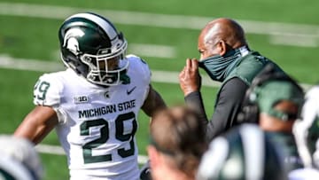 Michigan State's head coach Mel Tucker, right, talks with Shakur Brown after Brown's taunting foul against Michigan during the third quarter on Saturday, Oct. 31, 2020, at Michigan Stadium in Ann Arbor.201031 Msu Um 110a