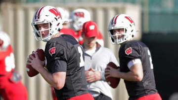 Wisconsin Badgers quarterback Jack Coan (17) and Wisconsin Badgers quarterback Chase Wolf (2) warm up during football practice Saturday,, December 28, 2019 in Los Angeles,The 8th ranked Wisconsin Badgers take on the 6th ranked Oregon Ducks in the Rose Bowl, January 1, 2019. RICK WOOD/MILWAUKEE JOURNAL SENTINEL ORG XMIT: 30099614ARosebowl Practice 09bwood