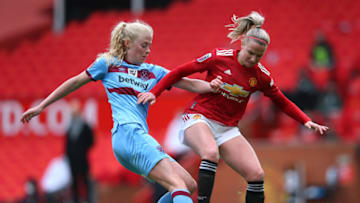 MANCHESTER, ENGLAND - MARCH 27: Jackie Groenen of Manchester United Women is tackled by Grace Fisk of West Ham United Women during the Barclays FA Women's Super League match between Manchester United Women and West Ham United Women at Old Trafford on March 27, 2021 in Manchester, England. Sporting stadiums around the UK remain under strict restrictions due to the Coronavirus Pandemic as Government social distancing laws prohibit fans inside venues resulting in games being played behind closed doors. (Photo by Alex Livesey - Danehouse/Getty Images)