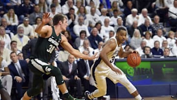 Jan 7, 2017; University Park, PA, USA; Penn State Nittany Lions guard Shep Garner (33) dribbles past Michigan State Spartans forward Matt Van Dyk (30) during the second half at Palestra. Penn State won 72-63. Mandatory Credit: Derik Hamilton-USA TODAY Sports