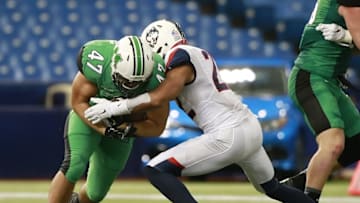 Dec 26, 2015; St. Petersburg, FL, USA; Marshall Thundering Herd running back Devon Johnson (47) runs with the ball against Connecticut Huskies safety Andrew Adams (22) during the first half at Tropicana Field. Mandatory Credit: Kim Klement-USA TODAY Sports