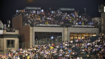 Aug 21, 2013; Chicago, IL, USA; The moon rises over the bleachers and rooftops during the fifth inning of a game between the Chicago Cubs and the Washington Nationals at Wrigley Field. Mandatory Credit: David Banks-USA TODAY Sports