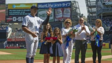 Sep 13, 2015; Bronx, NY, USA; New York Yankees designated hitter Alex Rodriguez (13) waves to the crowd with his family present after receiving gifts for his 3000 hit prior to the game against the Toronto Blue Jays at Yankee Stadium. Mandatory Credit: Gregory J. Fisher-USA TODAY Sports