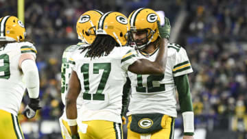 Dec 19, 2021; Baltimore, Maryland, USA; Green Bay Packers wide receiver Davante Adams (17) celebrates with quarterback Aaron Rodgers (12) after scoring a second quarter touchdown against the Baltimore Ravens at M&T Bank Stadium. Mandatory Credit: Tommy Gilligan-USA TODAY Sports