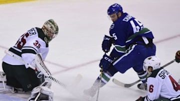 Nov 29, 2016; Vancouver, British Columbia, CAN; Minnesota Wild goaltender Darcy Kuemper (35) and defenseman Jared Spurgeon (46) defend against Vancouver Canucks forward Michael Chaput (45) during the third period at Rogers Arena. The Vancouver Canucks won 5-4. Mandatory Credit: Anne-Marie Sorvin-USA TODAY Sports