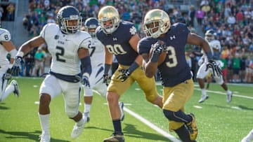 Sep 10, 2016; South Bend, IN, USA; Notre Dame Fighting Irish wide receiver C.J. Sanders (3) runs the ball as Navy Midshipmen safety Lorentez Barbour (2) pursues in the second quarter at Notre Dame Stadium. Mandatory Credit: Matt Cashore-USA TODAY Sports