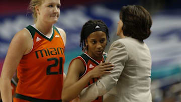 Mar 5, 2016; Greensboro, NC, USA; Miami (FL) Hurricanes head coach Katie Meier greets guard Adrienne Motley (23) and forward Emese Hof (21) as the season ends in the second half during the women
