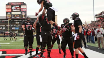 Dec 1, 2012; Jonesboro, AR, USA; Arkansas State Red Wolves wide receiver Rocky Hayes (38) is held up as he and teammates celebrate after a touchdown by Hayes against the Middle Tennessee Blue Raiders at Liberty Bank Stadium. Mandatory Credit: Nelson Chenault-USA TODAY Sports
