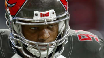 ATLANTA, GA - NOVEMBER 24: Ndamukong Suh #93 of the Tampa Bay Buccaneers reacts after scoring a touchdown in the second half of an NFL game against the Atlanta Falcons at Mercedes-Benz Stadium on November 24, 2019 in Atlanta, Georgia. (Photo by Todd Kirkland/Getty Images)
