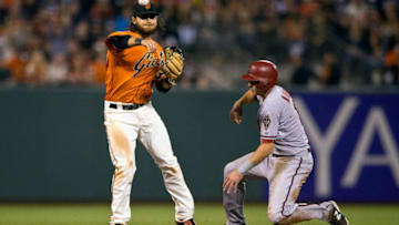 SAN FRANCISCO, CA - JUNE 12: Brandon Crawford #35 of the San Francisco Giants completes a double play around Nick Ahmed #13 of the Arizona Diamondbacks during the sixth inning at AT&T Park on June 12, 2015 in San Francisco, California. (Photo by Jason O. Watson/Getty Images)