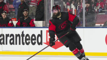 Feb 18, 2023; Raleigh, North Carolina, USA; dCarolina Hurricanes defenseman Brent Burns (8) skates with the puck against the Washington Capitals during the third period 2023 Stadium Series ice hockey game at Carter-Finley Stadium. Mandatory Credit: James Guillory-USA TODAY Sports