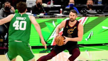 CLEVELAND, OHIO - MAY 12: Kevin Love #0 of the Cleveland Cavaliers drives against Luke Kornet #40 of the Boston Celtics during their game at Rocket Mortgage Fieldhouse on May 12, 2021 in Cleveland, Ohio. The Cleveland Cavaliers won 102-94. NOTE TO USER: User expressly acknowledges and agrees that, by downloading and or using this photograph, User is consenting to the terms and conditions of the Getty Images License Agreement. (Photo by Emilee Chinn/Getty Images)