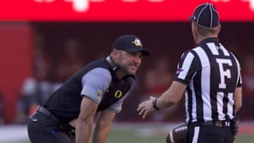 Sep 17, 2016; Lincoln, NE, USA; Oregon Ducks head coach Mark Helfrich talks to an official during the game against the Nebraska Cornhuskers in the second half at Memorial Stadium. Nebraska won 35-32. Mandatory Credit: Bruce Thorson-USA TODAY Sports
